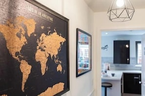 Explore the world from the comfort of this stylish space, featuring a large, framed world map.