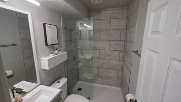 Shower, towels, soap, toilet paper