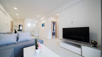 Familien-Suite, Balkon, Stadtblick | Hochwertige Bettwaren, Select-Comfort-Betten, kostenlose Babybetten