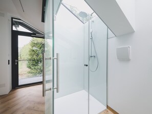 Shower, hair dryer, towels, toilet paper