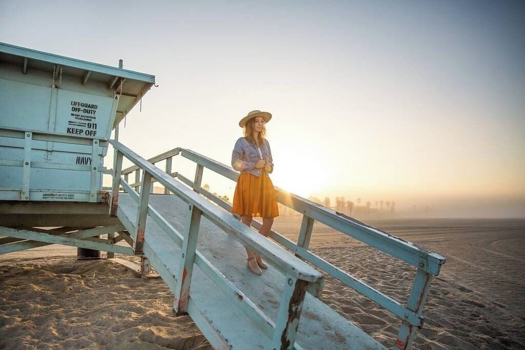 A lifeguard tower with a sign indicating it is off-duty.