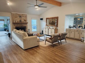 Smart TV, fireplace, books, printers