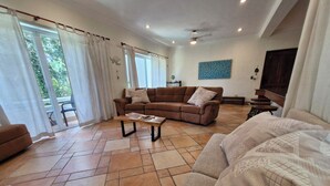 Apartment, 2 Bedrooms, Balcony, Garden View | Living room | Books - Luxurious Apartment in Playacar With Golf (Playa del Carmen)