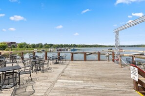 Outdoor dining - Cozy 1BR Condo w/ Balcony & Fireplace (Breezy Point)