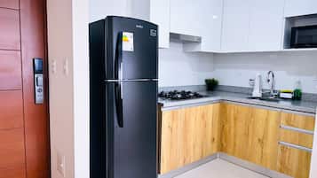 Microwave, oven, cookware/dishes/utensils, dining tables