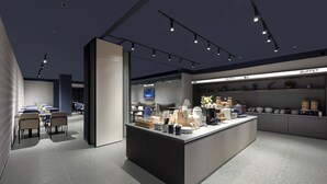A modern kitchen with a buffet area, equipped with various kitchen appliances and utensils.