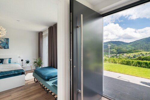 Appartement 'Luftige Auszeit' avec vue sur la montagne, terrasse privée et jardin