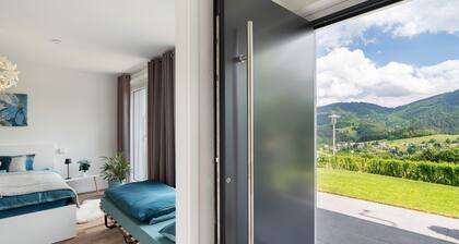 Appartement 'Luftige Auszeit' avec vue sur la montagne, terrasse privée et jardin