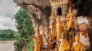 A temple with multiple Buddha statues and offerings.