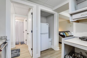 Enjoy cooking in this well-equipped kitchen with a refrigerator, oven, and sink.