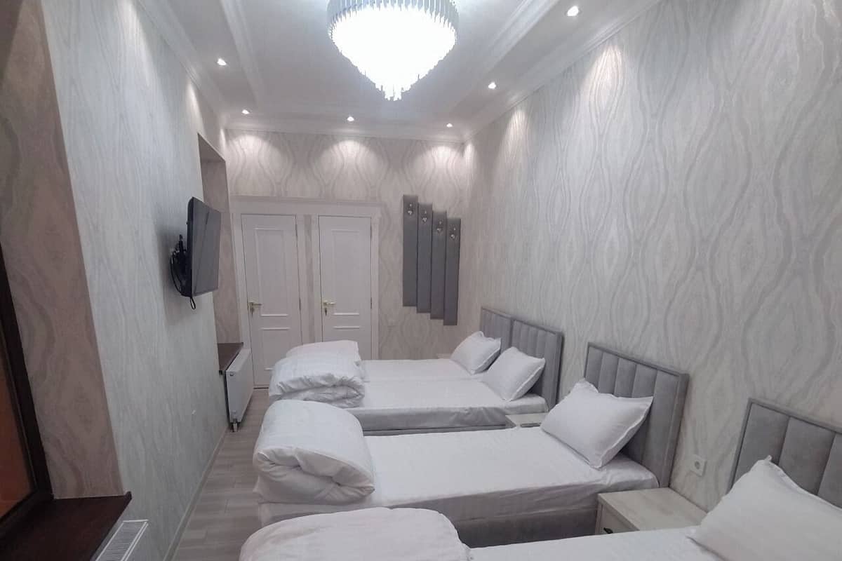 Quadruple Room, City View | Hypo-allergenic bedding available, minibar, desk, laptop workspace