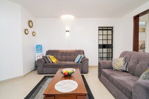 Deluxe Apartment, City View | Living area | 32-inch Smart TV with digital channels - Lux Suites Langata Paradise Apartments (Nairobi)