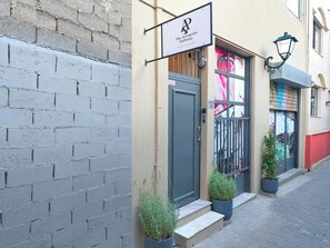 A building with a sign reading "The Acropolis Pathway" and a door labeled "Wilton 10". - The Acropolis Pathway (Athens)