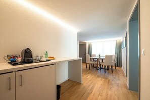 Quadruple Room, Mountain View | Living area | 100-cm flat-screen TV with cable channels, heated floors - Gästehaus Hirschen (Schänis)