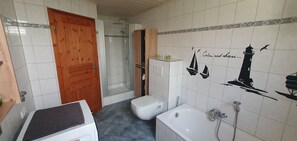 Shower, hair dryer, towels, toilet paper