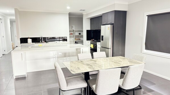 Dining - Modern 4BR Family Home with Pool, Gym & Garage – Quiet, Central Location (Rockbank)