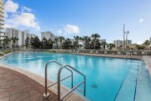Relax by the rectangular pool surrounded by a tiled deck and enjoy the city views.