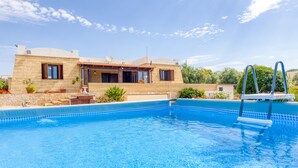 A modern house with a swimming pool, stone facade, and satellite dish. - Villa 'Marilor' with Sea View, Wi-Fi, and Air Conditioning (Salve)