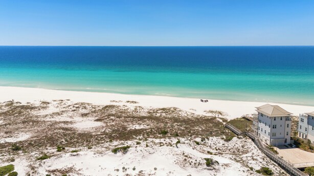 A beach view with a building adjacent to the shore. - Inlet Beach + Gulf View, Pet Friendly & Bikes (Inlet Beach)