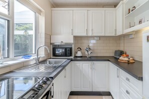 Fridge, microwave, oven, cookware/dishes/utensils