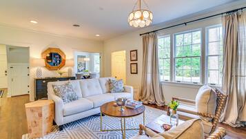 House (2 Bedrooms) | Living area | TV, fireplace, books