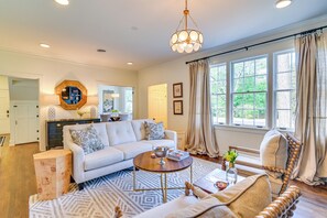 House (2 Bedrooms) | Living area | TV, fireplace, books