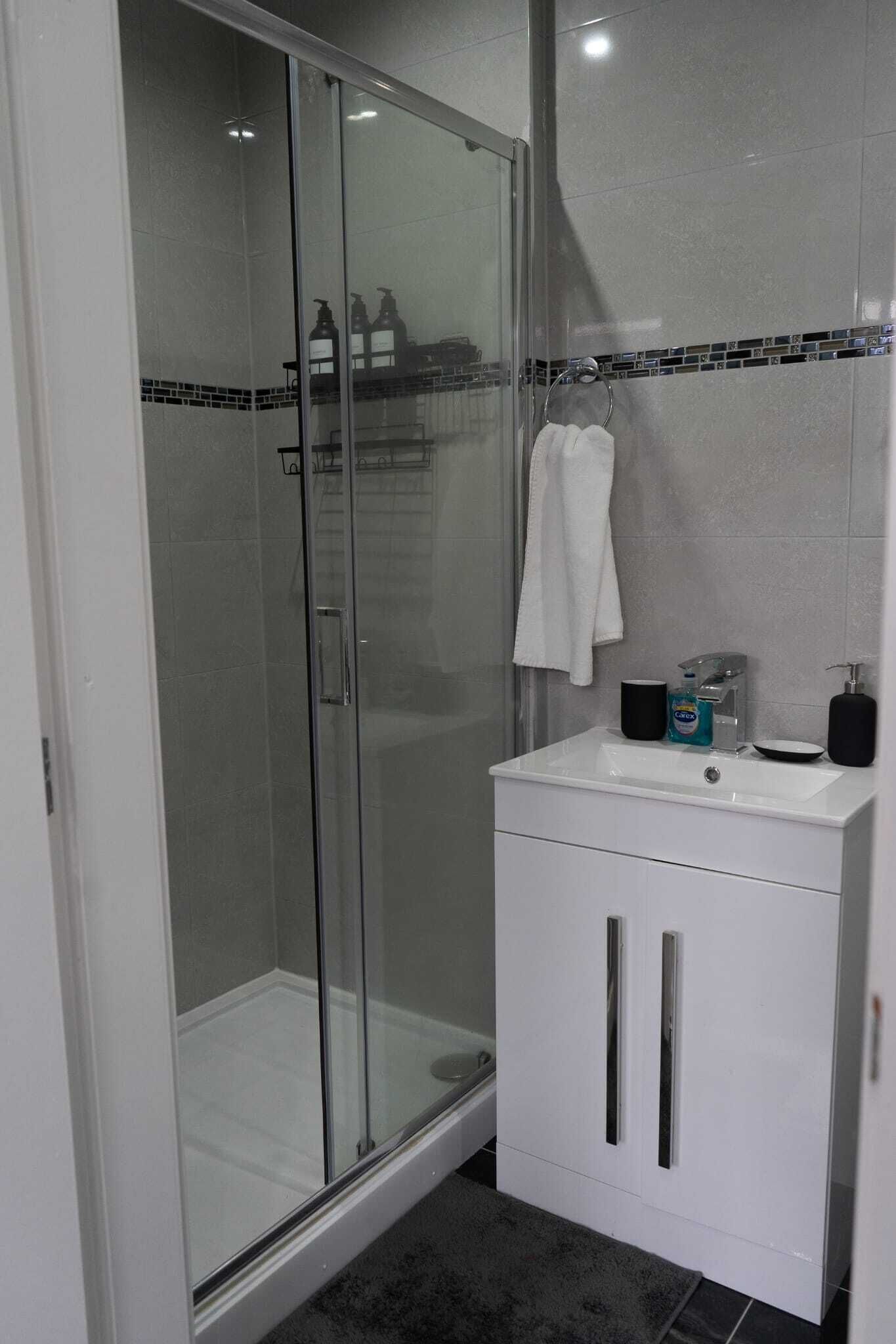 Shower, hair dryer, towels, soap