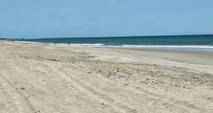 The "Bulldog Retreat" is a cozy condo just steps from the beach and large pool.