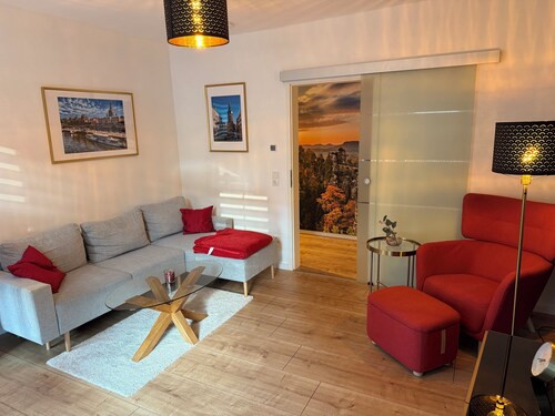 Modern vacation apartment, with parking space and terrace and barbecue