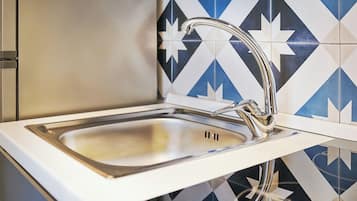 Camera quadrupla Comfort | Cocina privada | Frigobar
