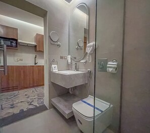 Suite, 1 Bedroom | Bathroom | Shower, hair dryer, bathrobes, slippers