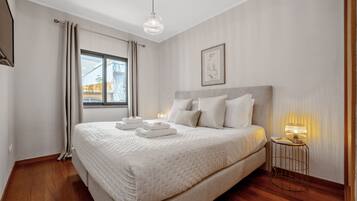 Iron/ironing board, travel crib, free WiFi, bed sheets