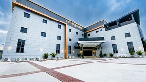 A modern hotel with a flat roof, multiple windows, and a central entrance. -  BASLEY HOTEL KUBWA ABUJA (Abuja)