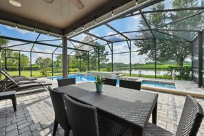 Outdoor dining - Spacious Solterra 5-Bedroom Resort Pool Home Near Disney with Lake View (Davenport)