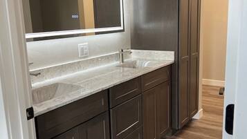 Shower, towels, soap, toilet paper