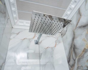 Shower, towels, soap, toilet paper