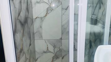 Shower, towels, soap, toilet paper