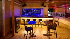 A bar area with a counter, chairs, and a pool table. - Elena Hotel Apartments (Parga)