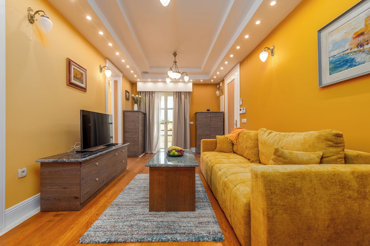 Deluxe Apartment | Living area | TV