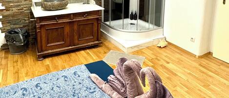 Shower, hair dryer, towels, soap