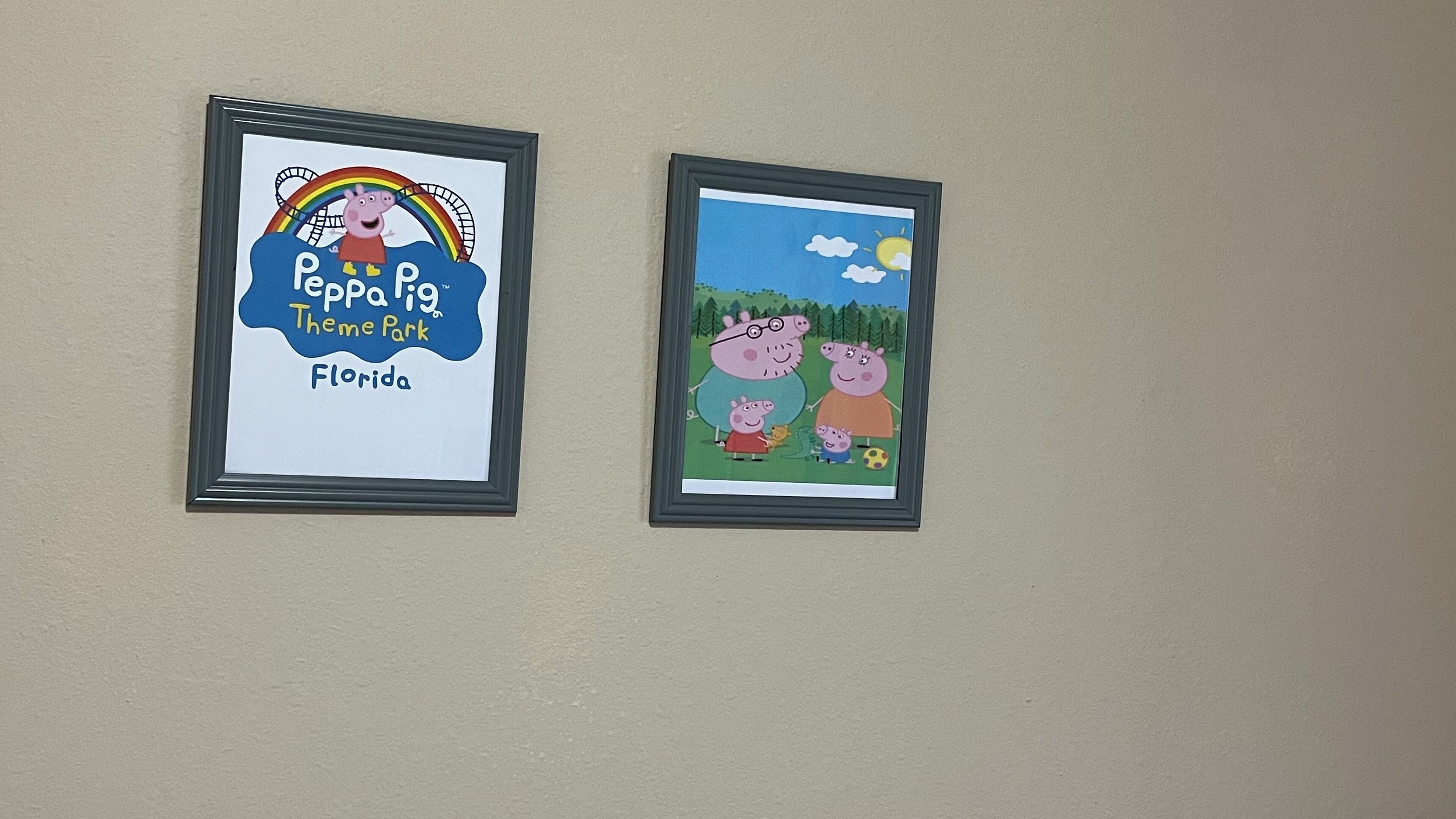 Two framed pictures on a wall.