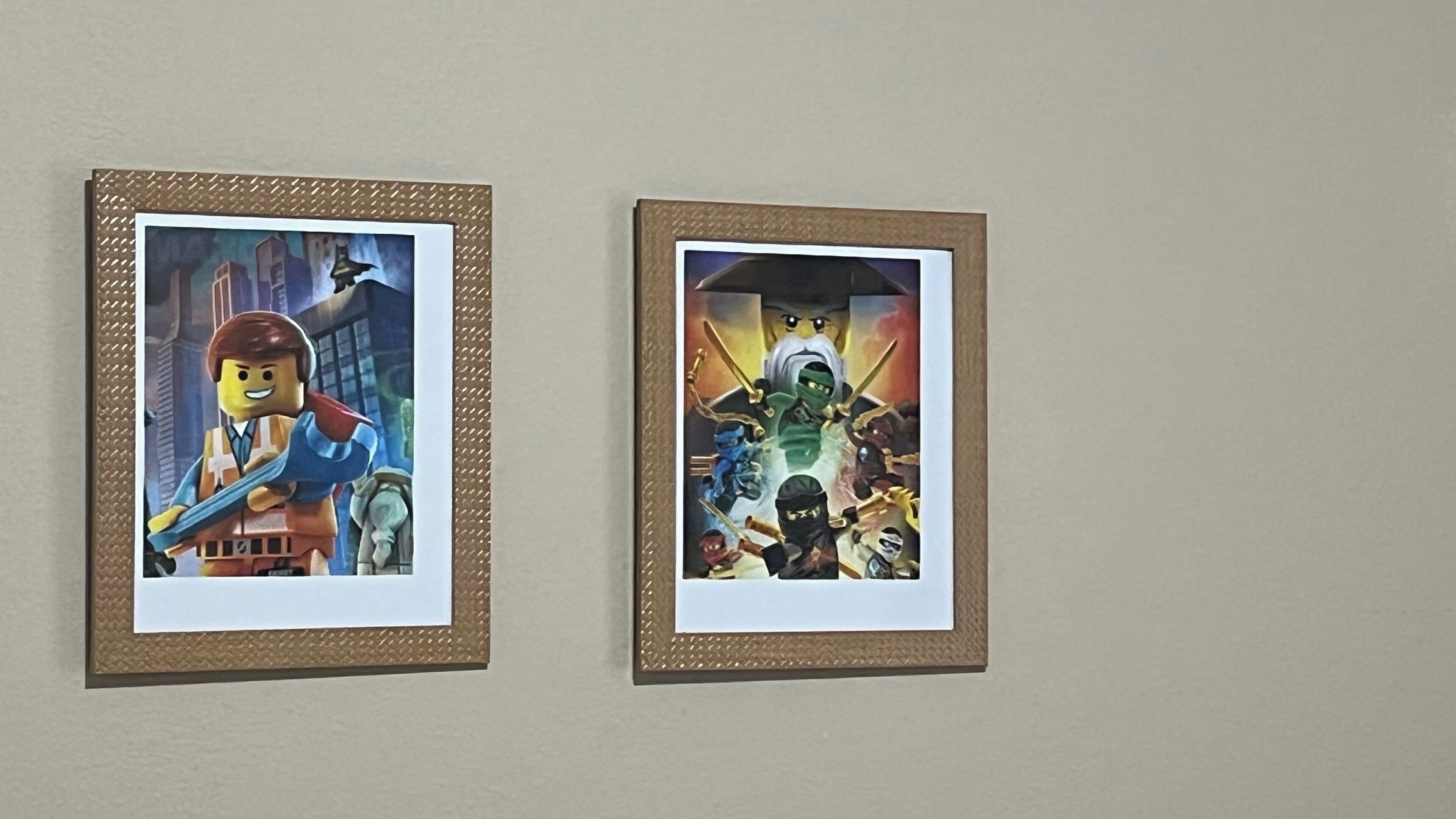 Two framed pictures on a wall.