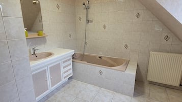 Shower, hair dryer, towels, toilet paper