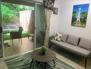 Living area - Chic 1-bedroom apartment with pool, WiFi, AC in Povai Bay near Matira Beach (Amanahune)