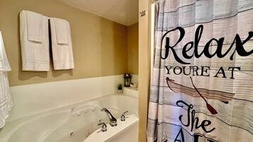 Jetted tub, hair dryer, towels