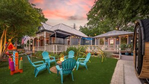 A patio area with outdoor seating and a fire pit.