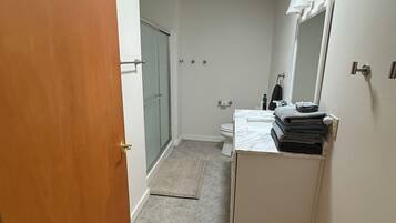 Shower, hair dryer, towels, soap