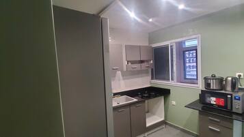 Fridge, microwave, stovetop, coffee/tea maker