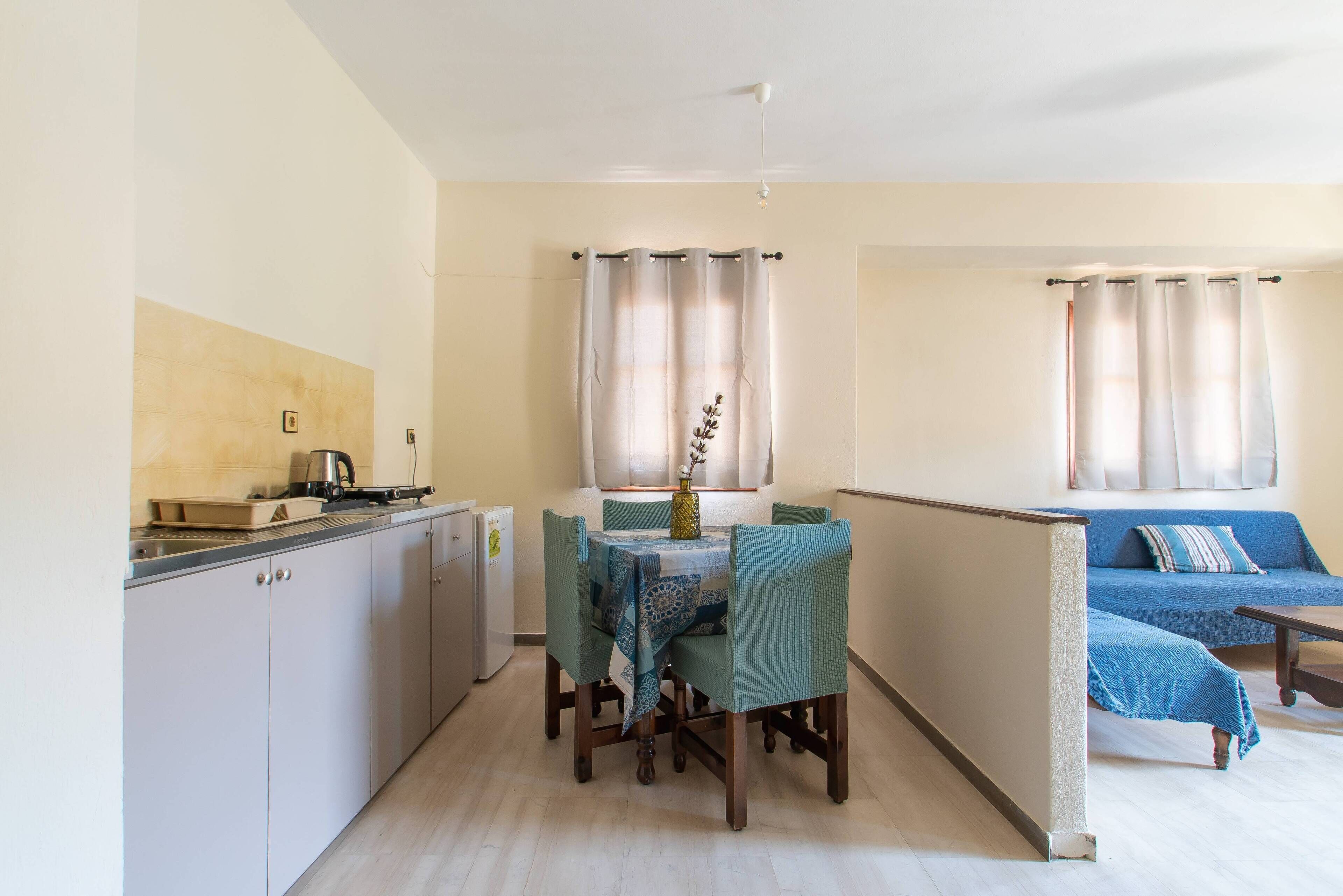 Mini-fridge, stovetop, electric kettle, cookware/dishes/utensils