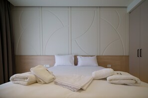 Deluxe loft room (mountain or pool view) | 1 bedroom, Frette Italian sheets, premium bedding, minibar - Noema Hotel (Igoumenitsa)